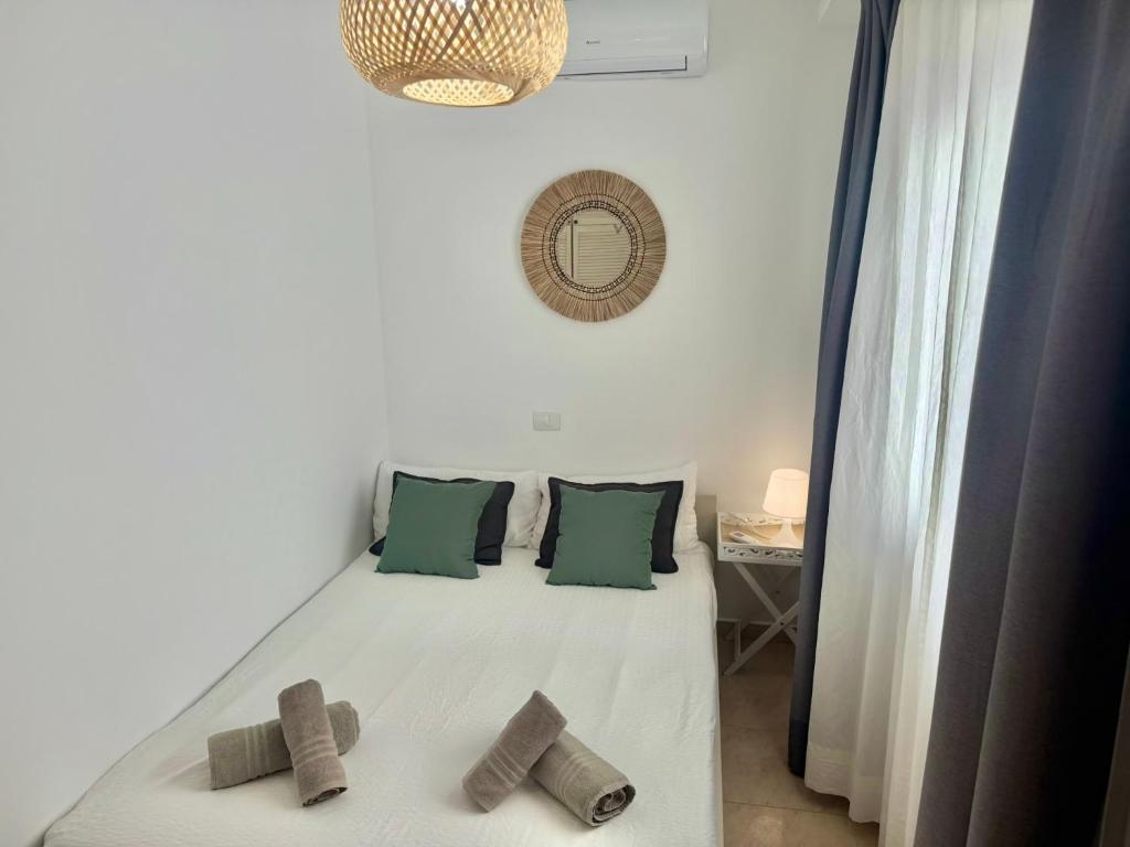 A bed or beds in a room at Dominos Apartment with heated pool by SunHousesCanarias