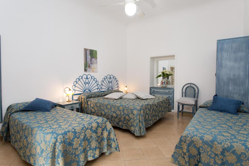 Postel nebo postele na pokoji v ubytování Hotel Poseidon