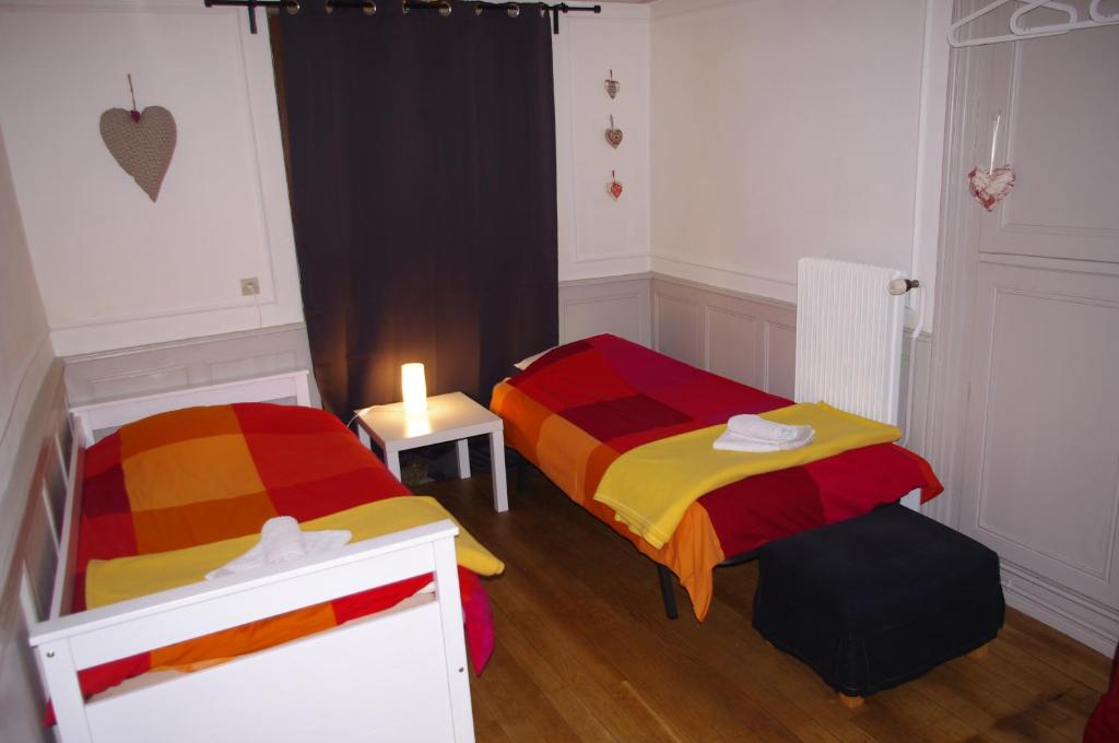 En eller flere senge i et værelse på Le Soleil