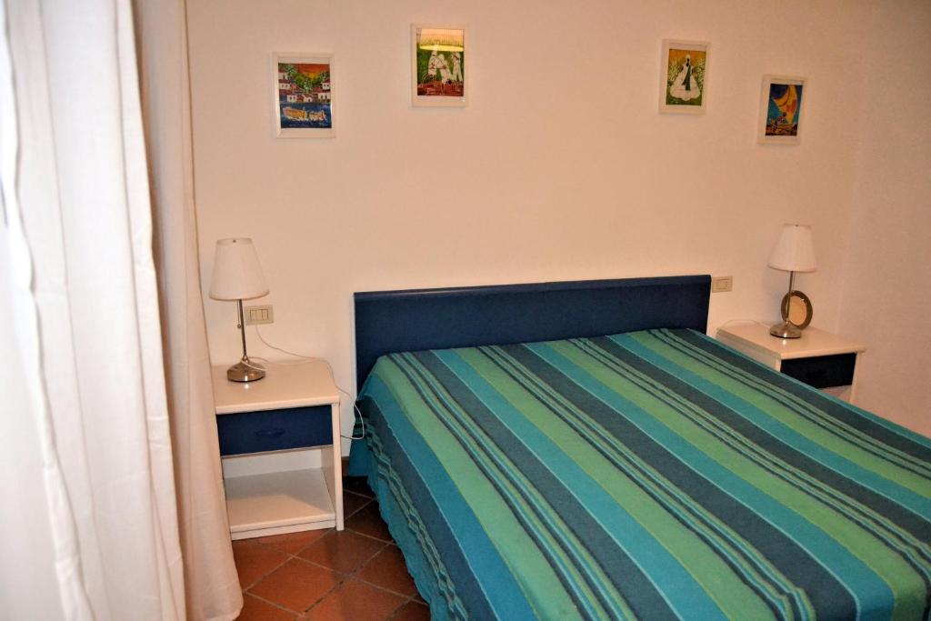 A bed or beds in a room at Le Soleil
