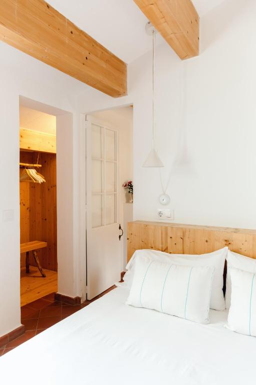 Postel nebo postele na pokoji v ubytování HoMe Hotel Menorca