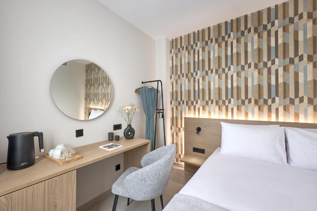 Postel nebo postele na pokoji v ubytování Athens City Suites