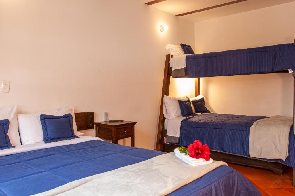 Cama o camas de una habitación en HOTEL RUTA 40 VILLA DE LEYVA