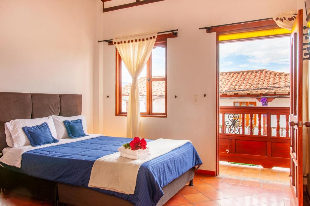Cama o camas de una habitación en HOTEL RUTA 40 VILLA DE LEYVA
