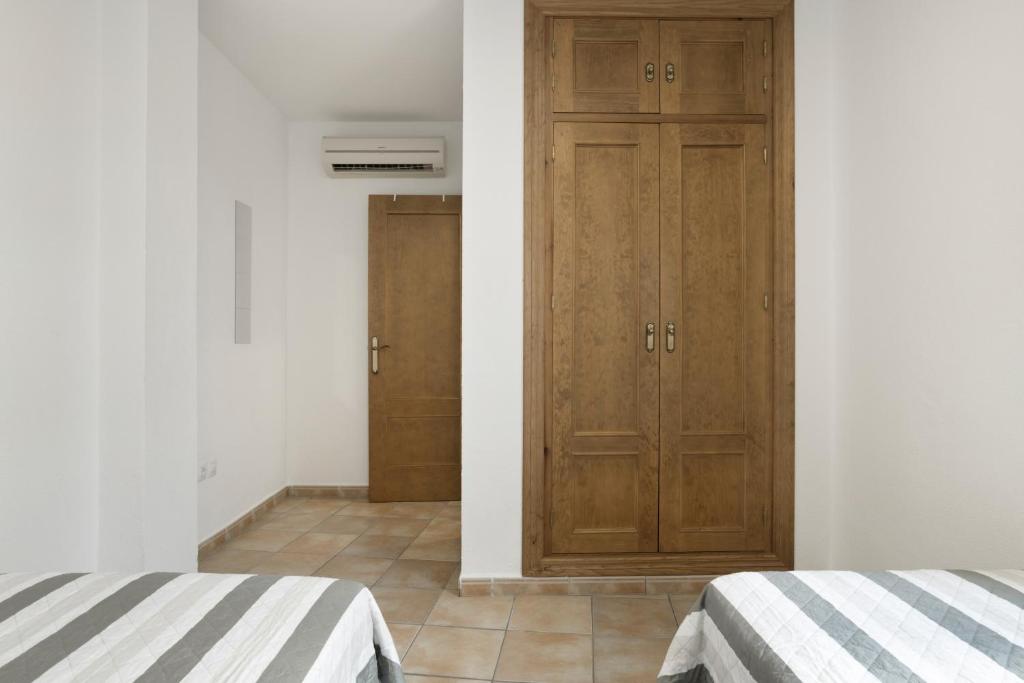 Posteľ alebo postele v izbe v ubytovaní Apartamento Perez Zara 3