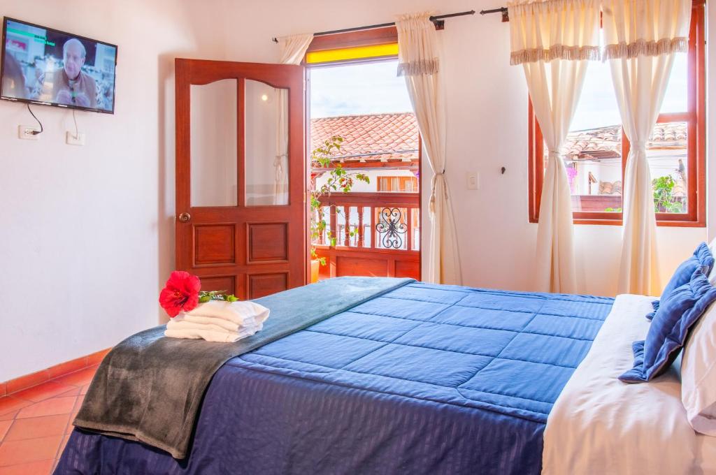 Cama o camas de una habitación en HOTEL RUTA 40 VILLA DE LEYVA