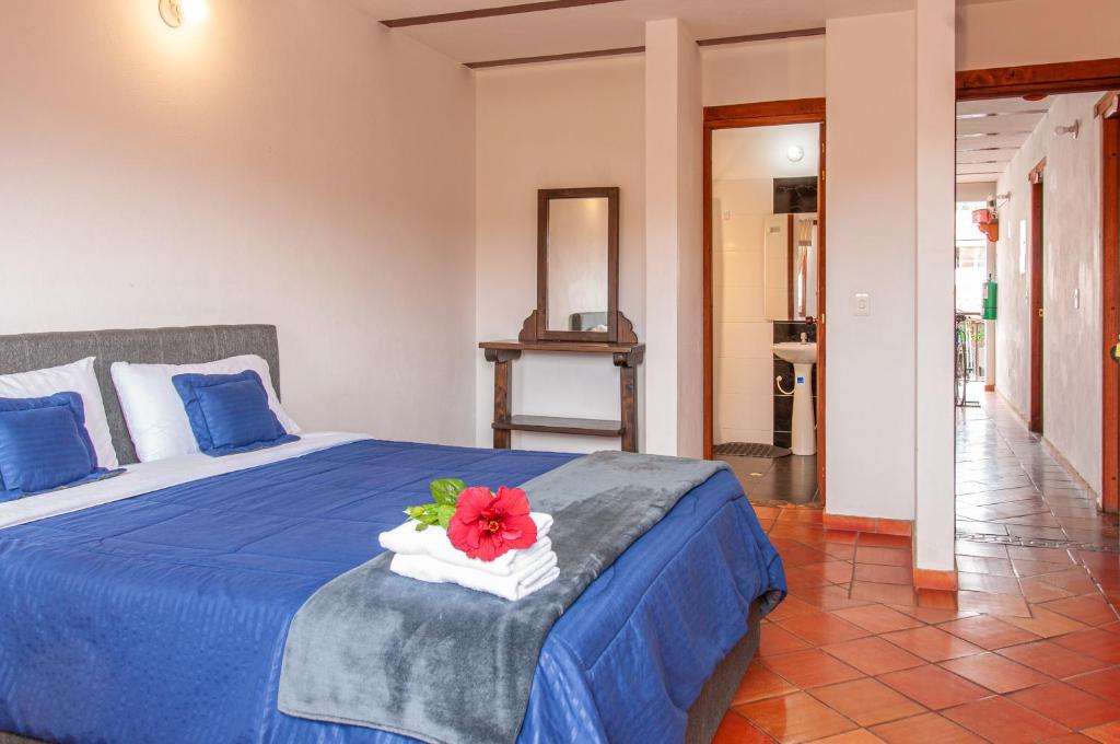 Cama o camas de una habitación en HOTEL RUTA 40 VILLA DE LEYVA