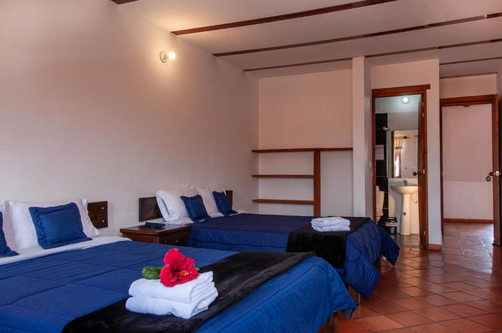 Cama o camas de una habitación en HOTEL RUTA 40 VILLA DE LEYVA