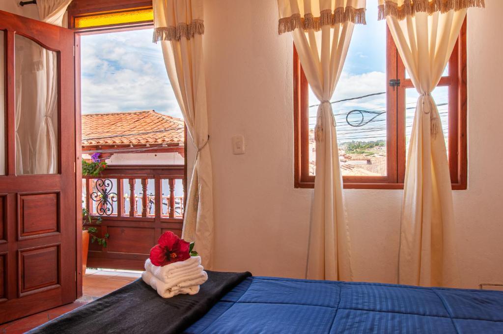 Cama o camas de una habitación en HOTEL RUTA 40 VILLA DE LEYVA