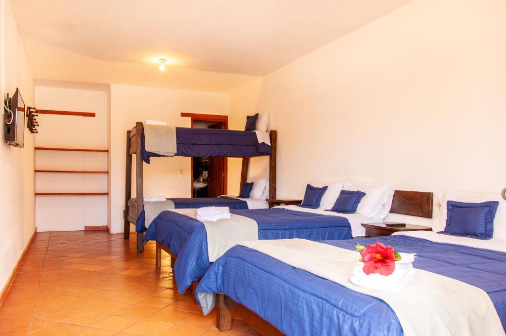 Cama o camas de una habitación en HOTEL RUTA 40 VILLA DE LEYVA