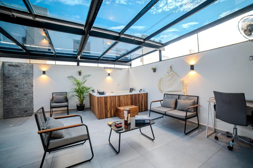 Posezení v ubytování Espectacular Casa de Ensueño "Jacuzzi Privado" en Ricaurte - Peñalisa