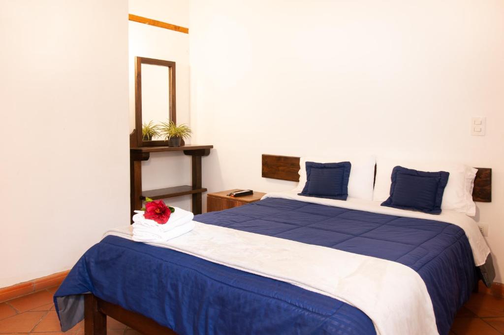 Cama o camas de una habitación en HOTEL RUTA 40 VILLA DE LEYVA