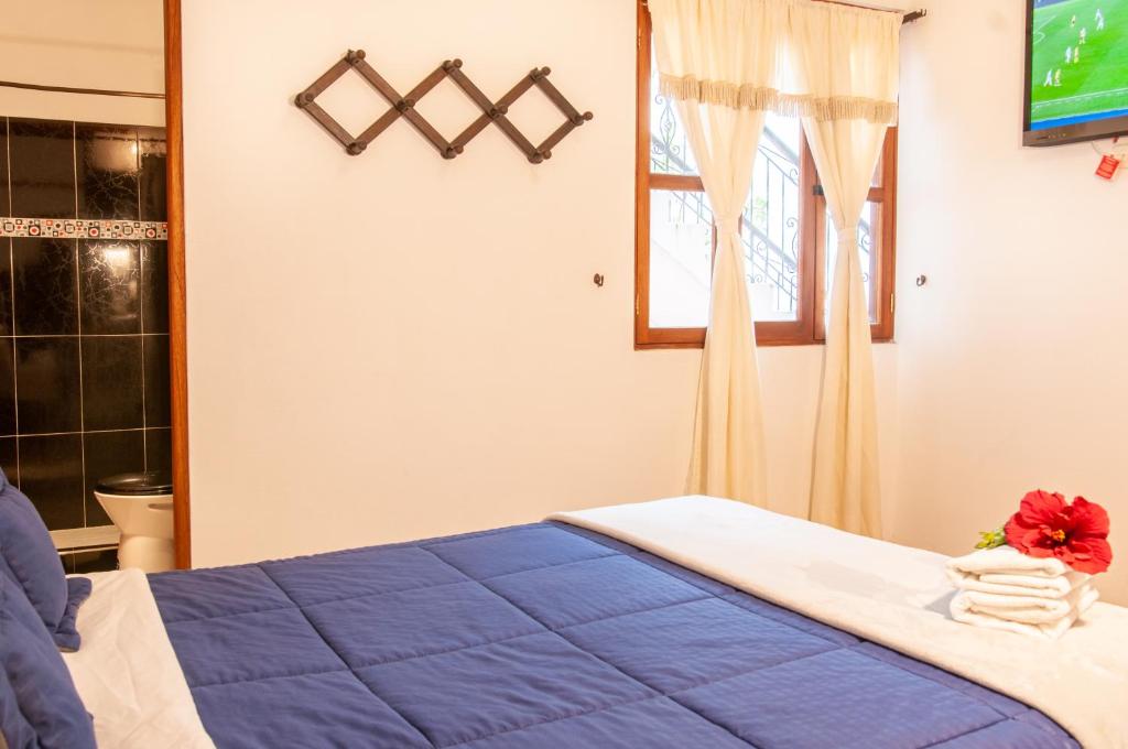 Cama o camas de una habitación en HOTEL RUTA 40 VILLA DE LEYVA