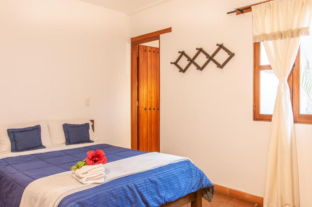 Cama o camas de una habitación en HOTEL RUTA 40 VILLA DE LEYVA