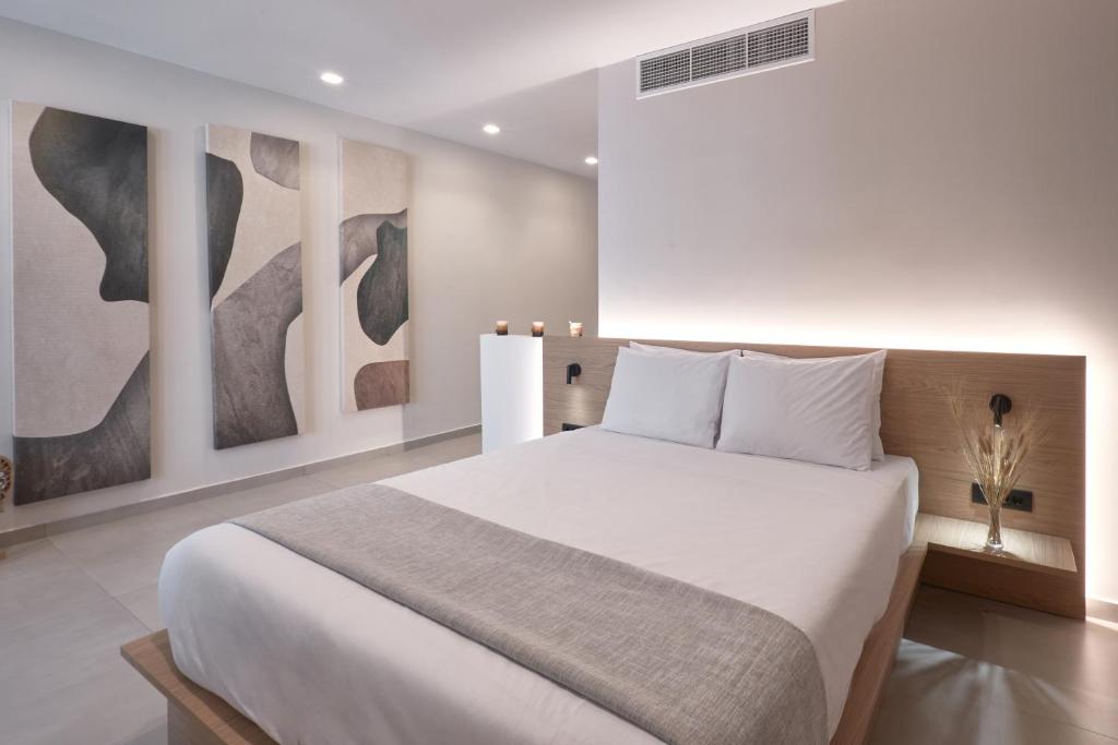 Postel nebo postele na pokoji v ubytování Athens City Suites