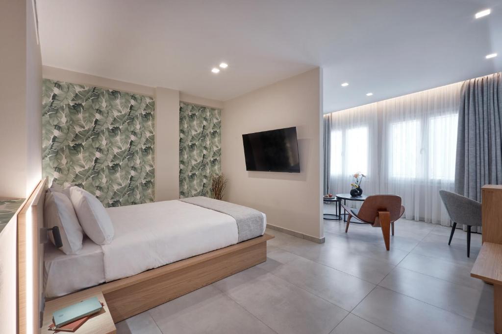 TV a/nebo společenská místnost v ubytování Athens City Suites