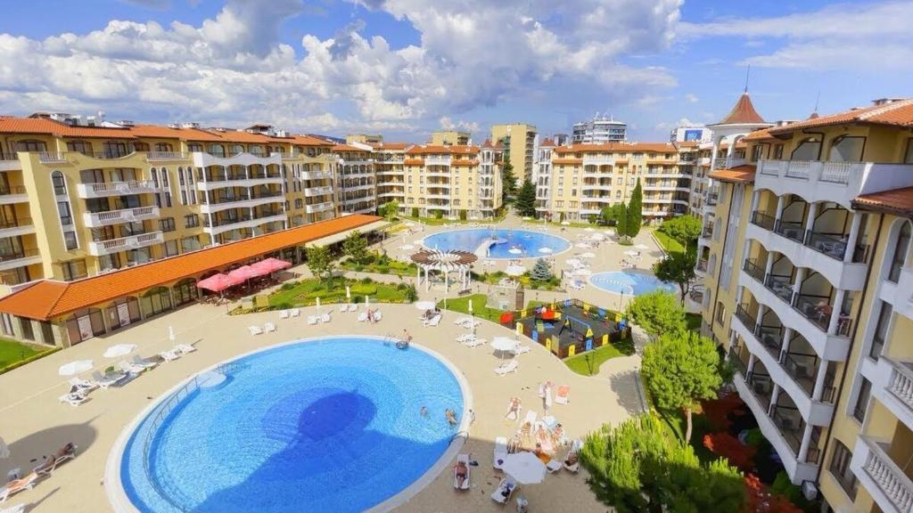 an overhead view of a large swimming pool in a resort at Apartment at Royal Sun, Sunny Beach in Sunny Beach