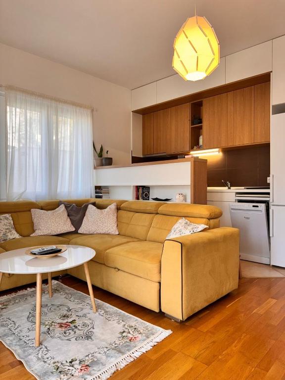 a living room with a couch and a table at Apartment Kristijan in Kotor