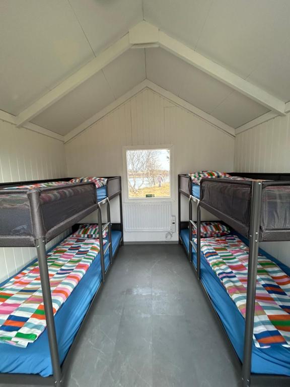 Letto o letti in una camera di Arhus Cottage and Camping