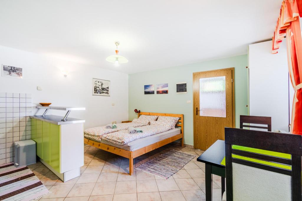 Postel nebo postele na pokoji v ubytování Apartma Vučič