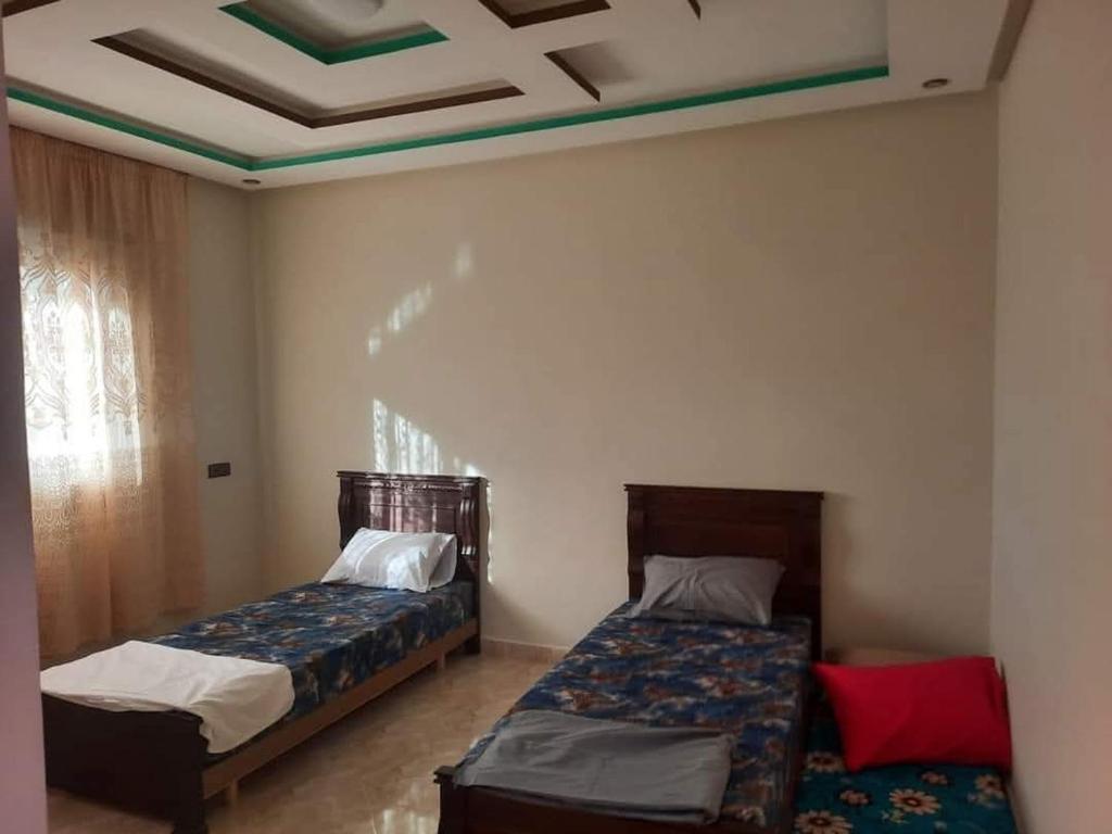 Ένα ή περισσότερα κρεβάτια σε δωμάτιο στο Riad sultan
