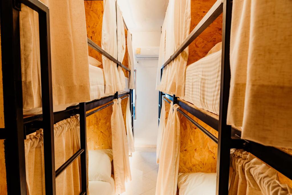 Postel nebo postele na pokoji v ubytování Kualena Hostal