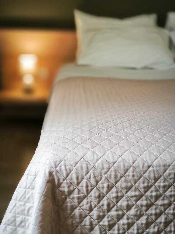 A bed or beds in a room at Penthouse 350m from metro station!