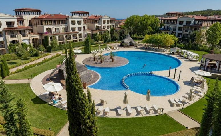 a large swimming pool in the middle of a resort at GL Beach Resort Private Studio Sozopol in Sozopol