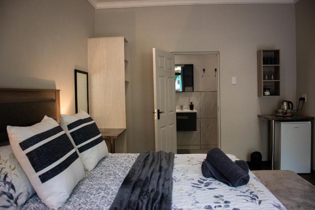 Letto o letti in una camera di The Garden Manor