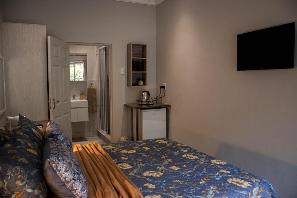 Letto o letti in una camera di The Garden Manor