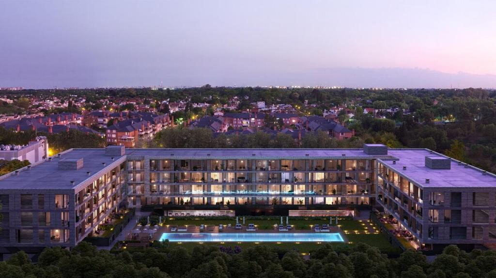 an aerial view of a building with a pool at Complejo Prana, pileta, parilla, cine y gimnasio in San Isidro