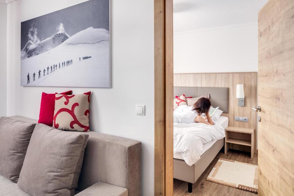 Postel nebo postele na pokoji v ubytování Alpenhotel Fernau