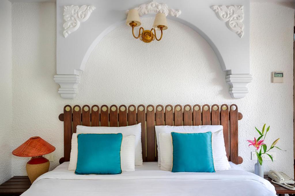 Postel nebo postele na pokoji v ubytování Ziva Suites - A Botique Hotel