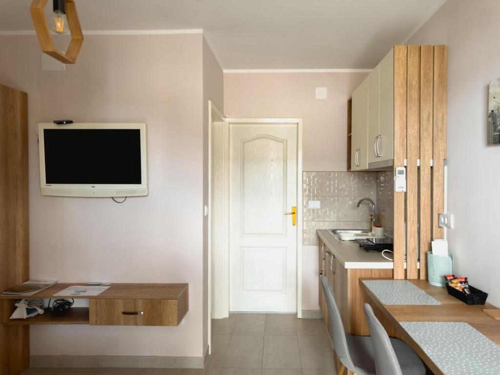 Kuchyň nebo kuchyňský kout v ubytování Apartmani AquaMarine