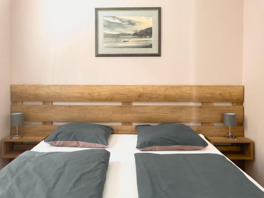 Postel nebo postele na pokoji v ubytování Apartmani AquaMarine