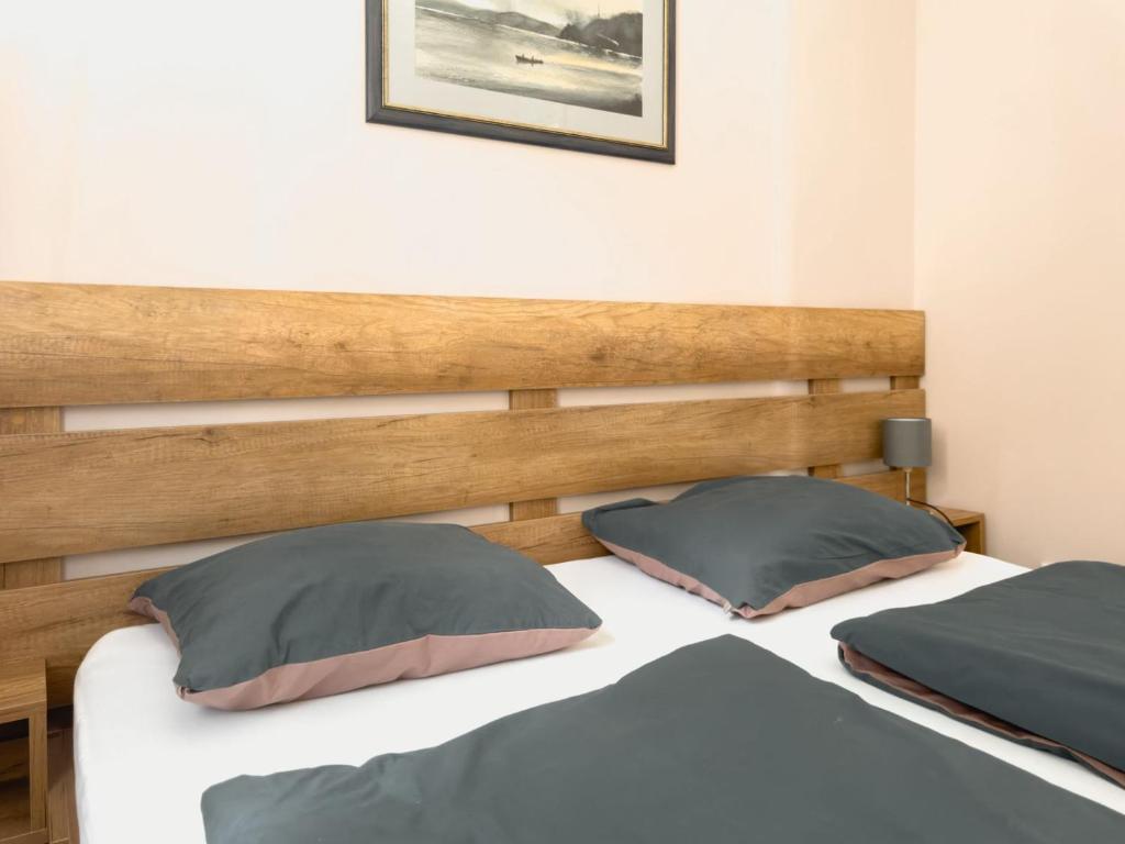 Postel nebo postele na pokoji v ubytování Apartmani AquaMarine