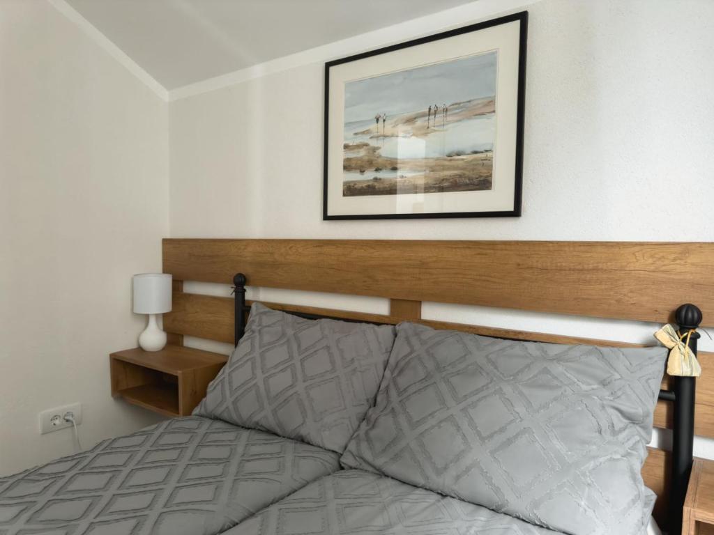Postel nebo postele na pokoji v ubytování Apartmani AquaMarine