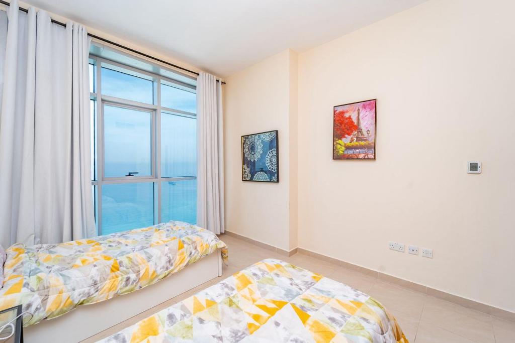 Voodi või voodid majutusasutuse Ocean View Luxury Suites toas