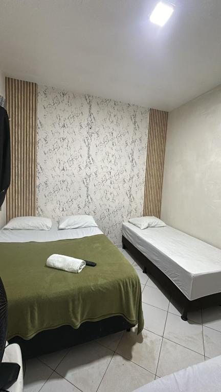 Postel nebo postele na pokoji v ubytování Lua Hotel