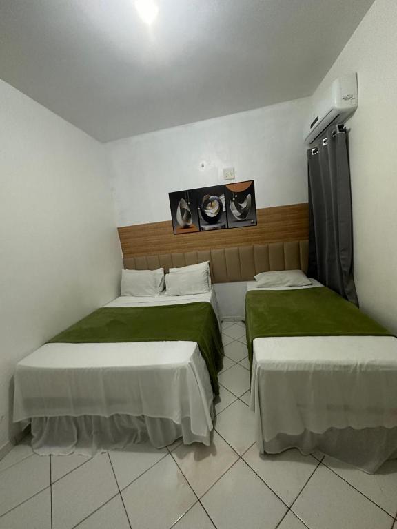 Postel nebo postele na pokoji v ubytování Lua Hotel