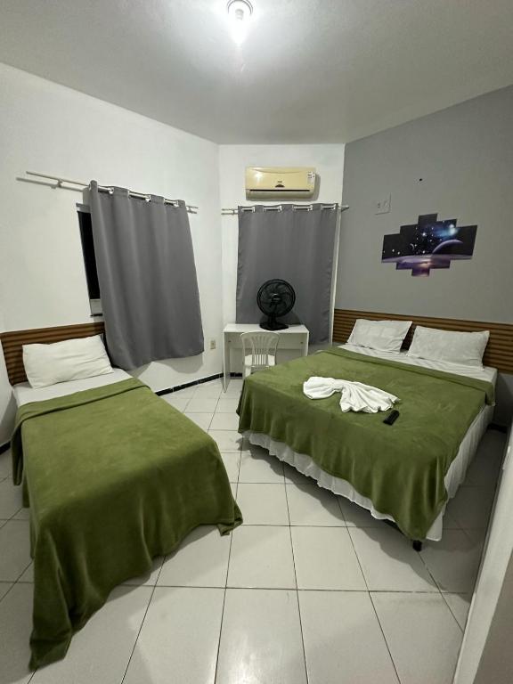 Postel nebo postele na pokoji v ubytování Lua Hotel