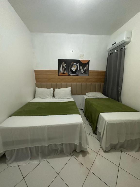 Postel nebo postele na pokoji v ubytování Lua Hotel