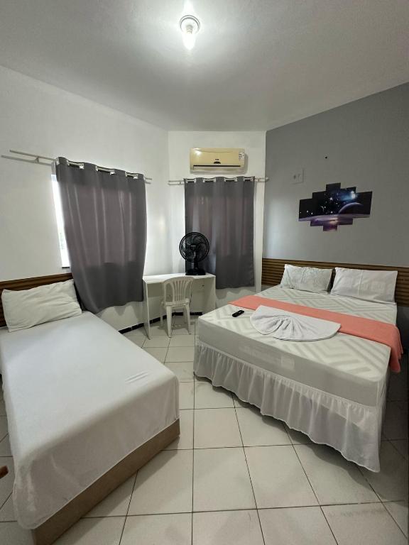 Postel nebo postele na pokoji v ubytování Lua Hotel