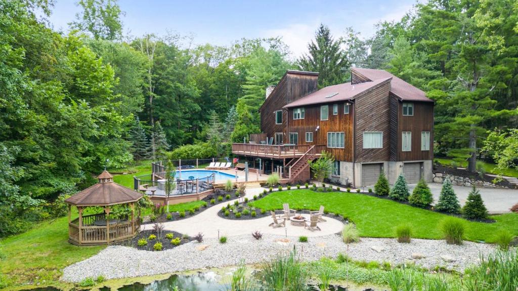 an aerial view of a large house with a garden at Upper Saddle River Resort w Pool, Hot Tub & Lake in Airmont