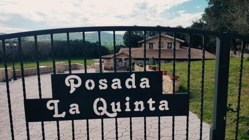 a sign on a gate in front of a house at La Quinta Luxury Palace in Arnuero