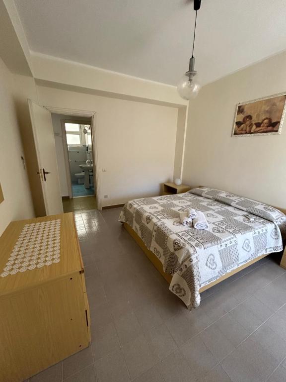 Ένα ή περισσότερα κρεβάτια σε δωμάτιο στο La pineta Apartment Tropea