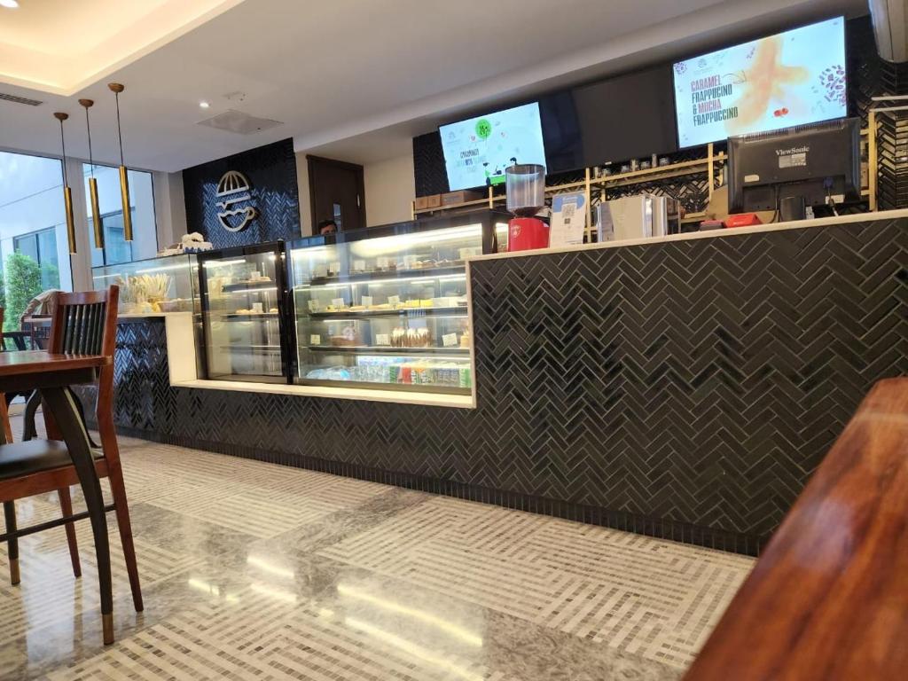 a restaurant with a counter with a buffet of food at Oyster court gulberg in Lahore