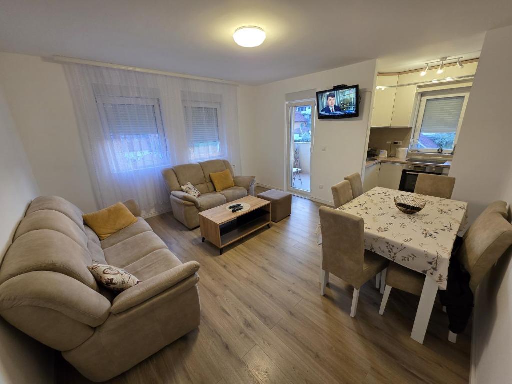 a living room with a couch and a table at Varosmala in Novi Pazar