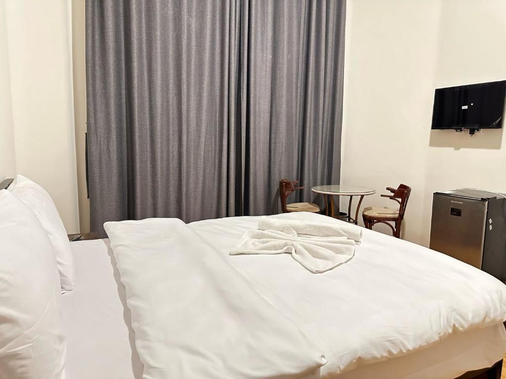 Postel nebo postele na pokoji v ubytování havana hotel