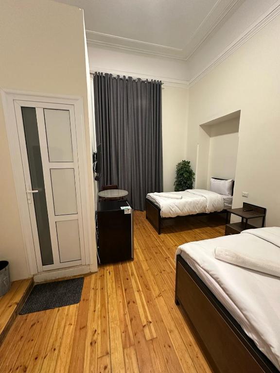Postel nebo postele na pokoji v ubytování havana hotel